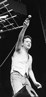Jim Kerr, lead singer of the rock group Simple Minds entertains the crowd at the groups