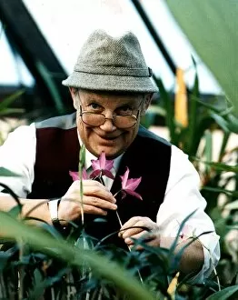 Images Dated 4th March 1996: Jim McColl Beechgrove Garden television presenter with flowers tweed hat glasses at