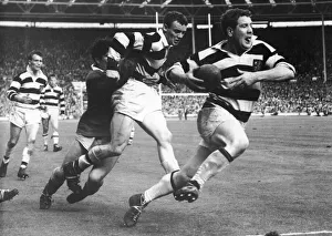 Jim Measures tangles with Hulls defence giving Frank Collier time