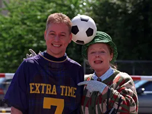 Jim White with Gwyneth Guthrie (Mrs Mack) with football balanced between their heads
