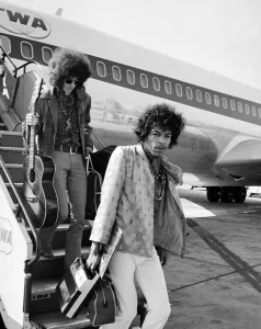 Plane Prints: Jimi Hendrix arrives with members of his band The Jimi Hendrix Experience