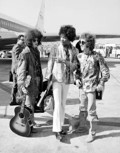 Plane Prints: Jimi Hendrix arrives with members of his band The Jimi Hendrix Experience