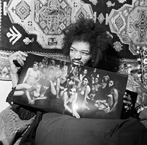 Images Dated 26th August 2015: Jimi Hendrix in London flat January 1969 getting teeth into ladyland at his Mayfair flat