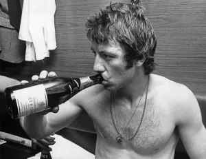 Dressing Room Prints: Jimmy Case celebrates the League Championship title with a bottle of champagne in