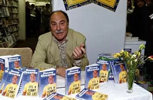 Images Dated 26th April 1990: Jimmy Greaves former England footballer signs copies of his book It