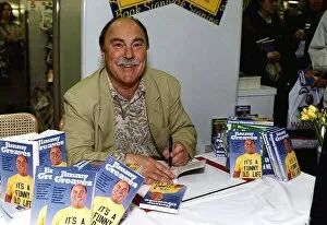 Images Dated 26th April 1990: Jimmy Greaves former England footballer signs copies of his book at W H Smiths in Holborn