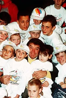 Jimmy Tarbuck TV Presenter Comedian at Heathrow with handicapped children who are on a