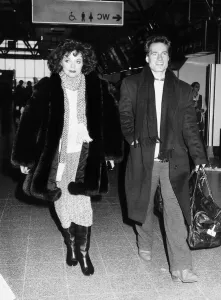 Casual Prints: Joan Collins the actress with actor Neil Dickinson on their way to Los Angeles in