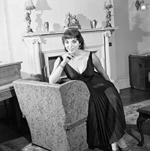 00661 Collection: Joan Collins, actress, aged 22, pictured wearing black silk cocktail dress
