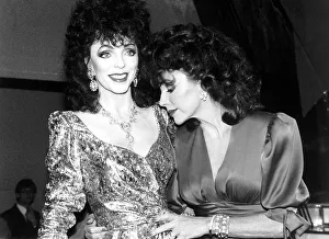 Joan Collins Actress holding waxwork model of herself March 1989