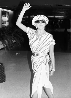 Joan Collins actress leaving London for Los Angeles to start a shoot of a new series of