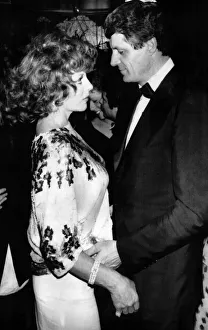 Man And Woman Prints: Joan Collins the actress with Muck Flick at a late night disco in May 1984