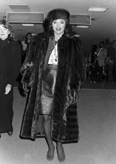 Screen Prints: Joan Collins actress starred in Dynasty arrives at Heathrow. November 1988