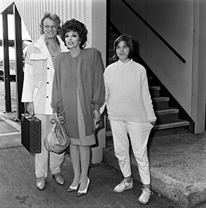 Joan Collins arrives at LAP from Los Angeles with her boyfriend Peter Holm
