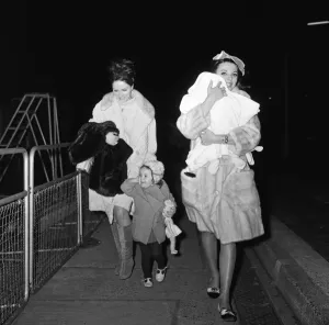 Joan Collins arriving by British European Airways from Paris with her daughter Tara