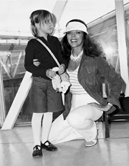 Joan Collins and daughter Katyana at Heathrow airport - April 1978