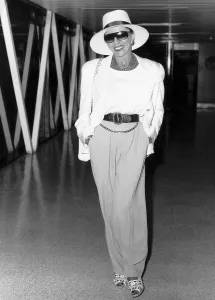 Joan Collins the english actress at Heathrow airport in August 1988