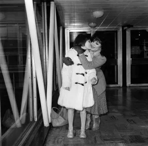 Joan Collins at Heathrow Airport with her daughter Katyana after a holiday in the Bahamas