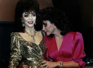 Joan Collins inspects her waxwork model at Madame Tussauds March 1989