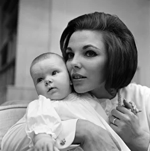 Joan Collins pictured with her four-month-old daughter Tara Newley