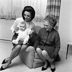 Joan Collins pictured with her four-month-old daughter Tara Newley
