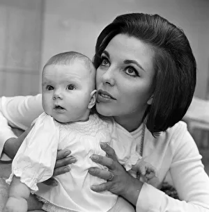 Joan Collins pictured with her four-month-old daughter Tara Newley