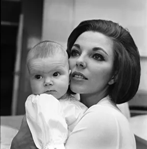 Joan Collins pictured with her four-month-old daughter Tara Newley