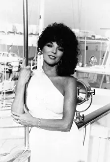 Joan Collins posing on quayside at Cannes film festival - May 1979