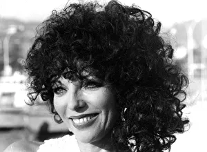 Joan Collins posing on quayside at Cannes film festival - May 1979