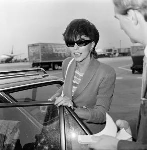Joan Collins with her son Sacha, 17, arriving at Heathrow from Los Angeles