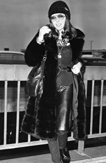 01415 Collection: Joan Collins wearing fur coat at London Airport - December 1971