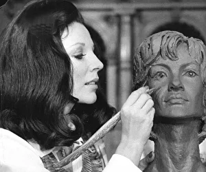Author Prints: Joan Collins working on a clay bust during filming at Elstree Studios