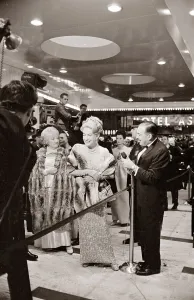 Joan Crawford at the Premier of My Fair Lady film in New York laughing