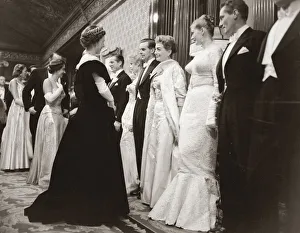 00501 Prints: Joan Crawford at the Royal Film Show, talking to the Queen of England smiling
