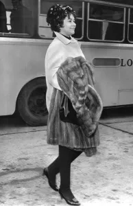 Joan Plowright carrying fur coat at Heathrow Airport - 24 / 02 / 1962