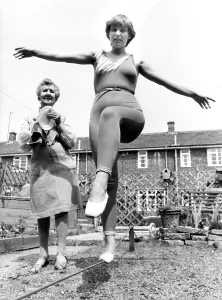 Balancing Prints: Joanna Curtis practising the tight-rope watched by nana Julia Holtby