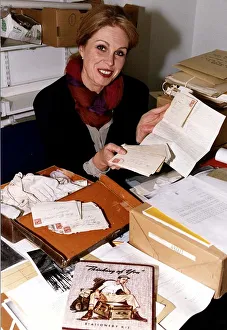Joanna Lumley actress at the Imperial War Museum holding some letters from soldiers