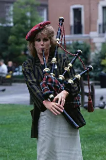 00194 Prints: Joanna Lumley actress June 1989 trying to play bagpipes