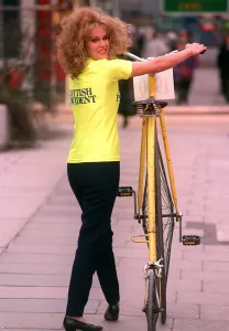 Joanna Lumley about to ride a Penny Farthing Bicycle 1990 at the launch of City