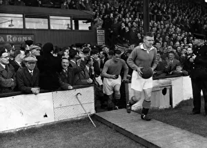 Jock Shaw leads out the Rangers team, followed by Dawson before the Clyde v Rangers