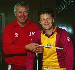 Jock Wallace with measuring tape around Andy Ritchie July 1983