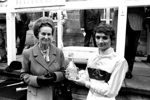Jockey Walter Swinburn receives a winners trophy at Gosforth Park Racecourse, Newcastle