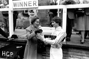 00116 Prints: Jockey Walter Swinburn receives a winners trophy at Gosforth Park Racecourse, Newcastle