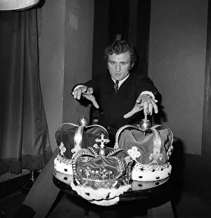 Joe Bugner reaches for Henry Coopers three crowns having signed to fight Henry at Wembley