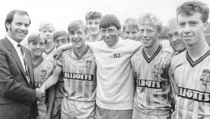 Joe Elliott shakes on a shirt sponsorship deal for Coventry City