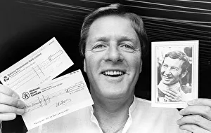 Money Prints: Joe Gaskin holding cheques signed by Lester Piggott and Willie Carson which will be