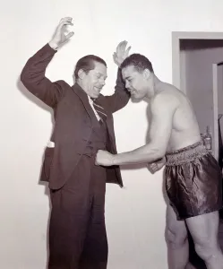 Joe Louis with Peter Wilson SP at Earls Court Boxer boxing
