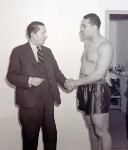 Joe Louis with Peter Wilson SP at Earls Court Boxer boxing