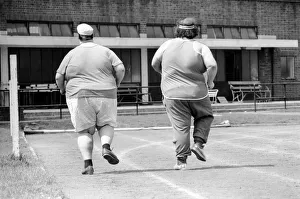 Working Out Prints: Jogger-nauts: John Robinson sports writer with Colin Taylor jogging in Battersea Park