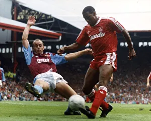 John Barnes (R) playing for Liverpool against Aston Villa 1990